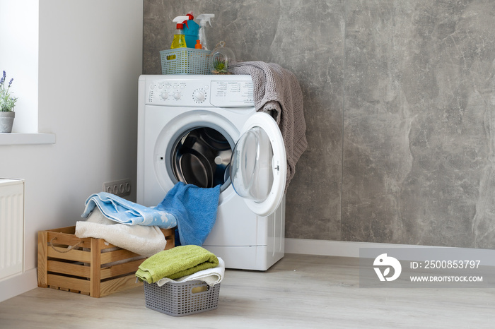 Contemporary luxury laundry in a brand new apartment in white.