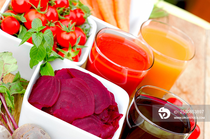 Slice of beet in bowl, beet juce, tomato juice and carrot juice, healthy drinks as strong antioxidants