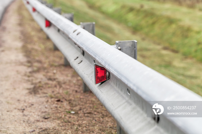 Metal guardrail mounted on a highway roadside