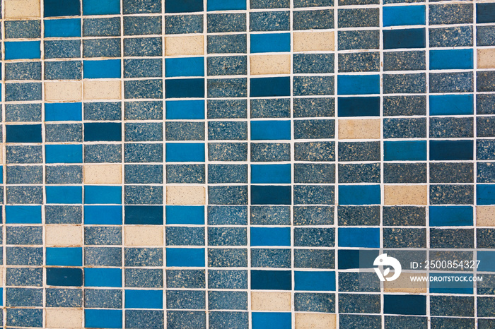 abstract background mosaic tiles of the facade of a mid century modern office building