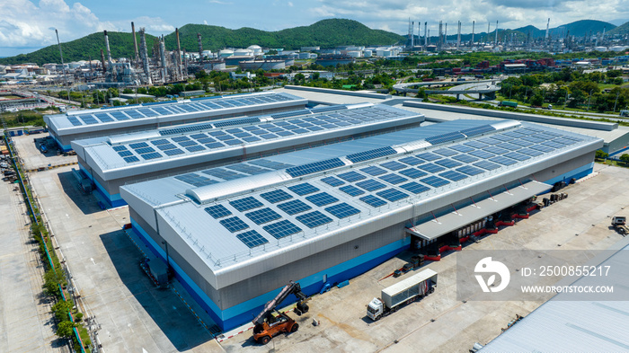 Top view Solar Cell on Warehouse Factory. Solor photo voltaic panels system power or Solar Cell on industrial building roof for producing green ecological electricity. Production of renewable energy.