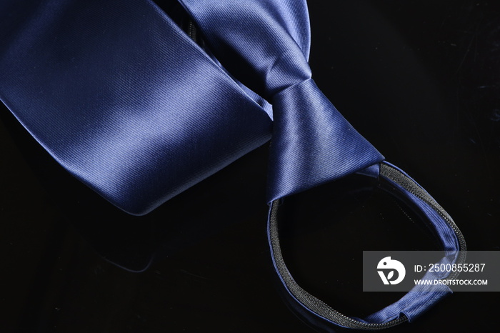 blue colour tie on black background