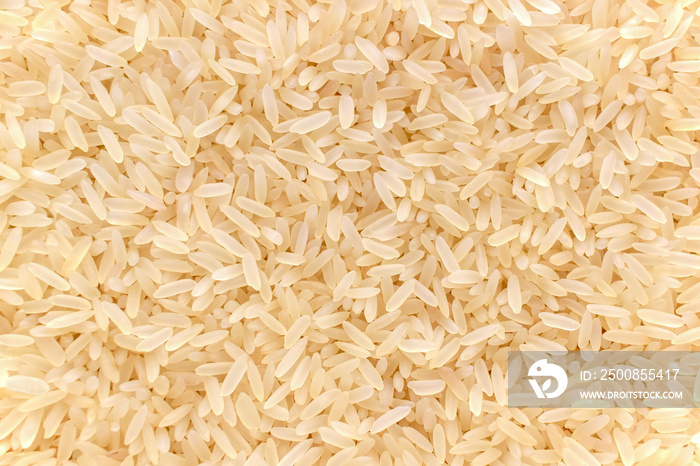 Parboiled rice texture background.  Uncooked food background.