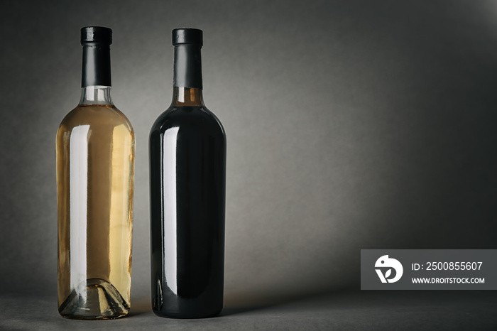 Bottles of wine on gray background