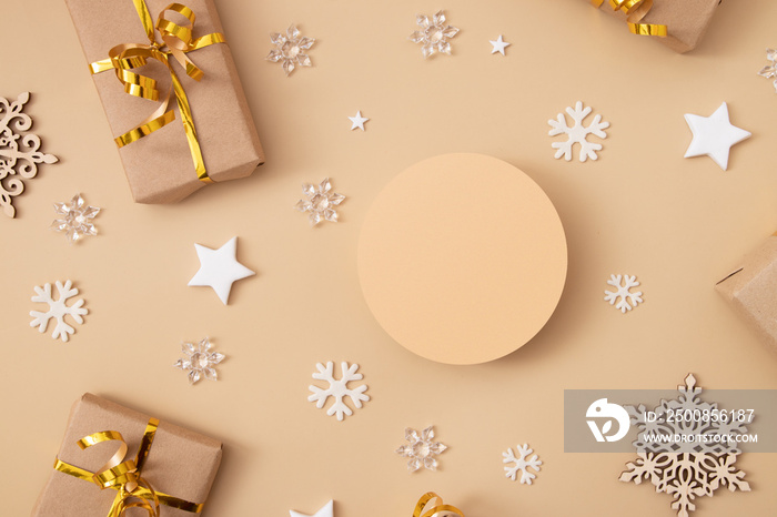 Podium or pedestal mock-up for cosmetics in the christmas or new year decorations top view on pastel beige background