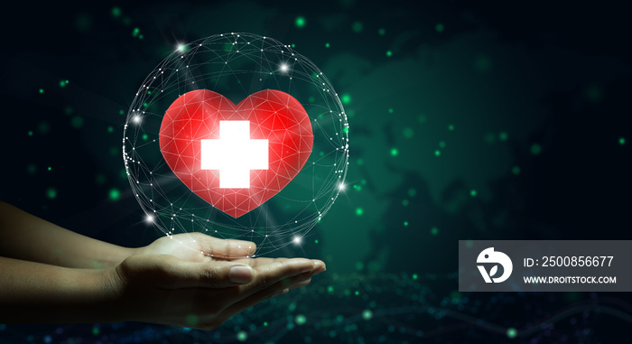 Hand holding red heart with white cross symbol. World map background. Health care, Health insurance, Charity, and Medicine concept. Copy space.