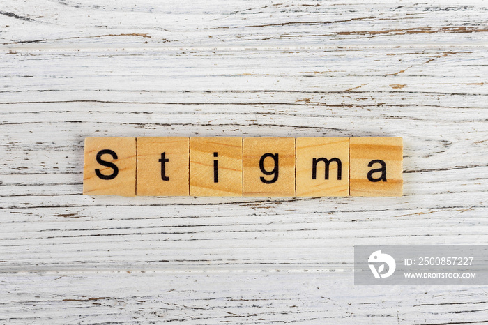 STIGMA word made with wooden blocks concept