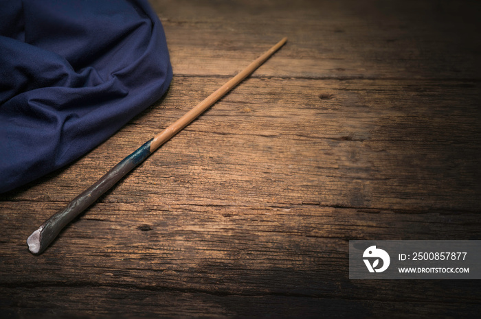 Magic wand on wooden table, Magic wand Wizard tool on vintage wooden background.