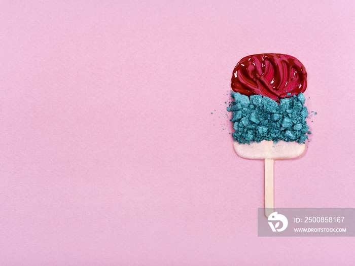 Colorful cosmetics arranged in ice cream shape.