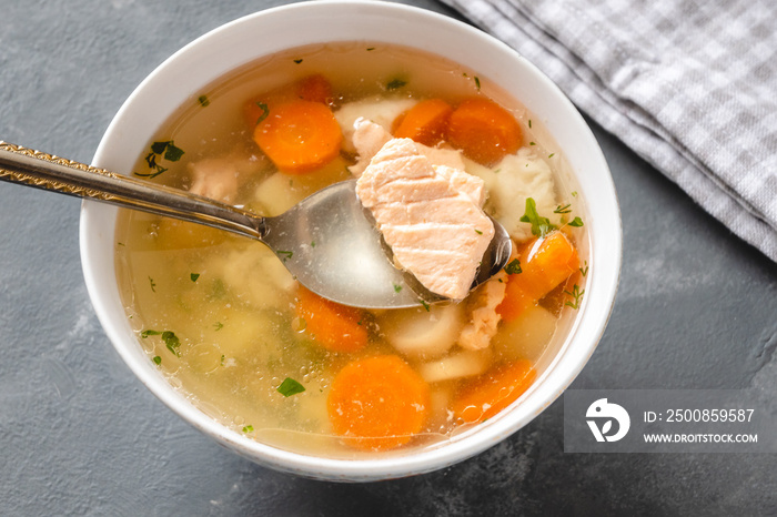 Fish soup with pieces of salmon and cod with vegetables