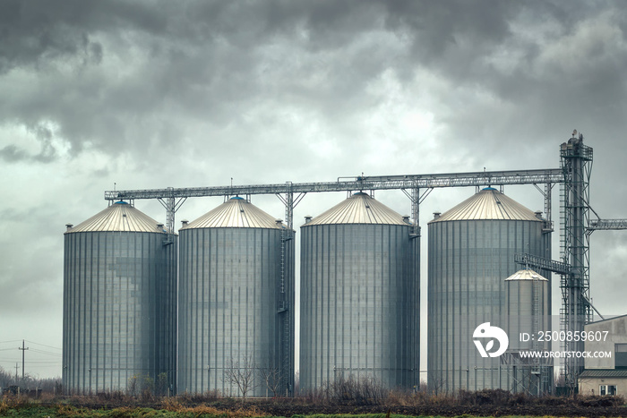 Grain silos on cloudy day