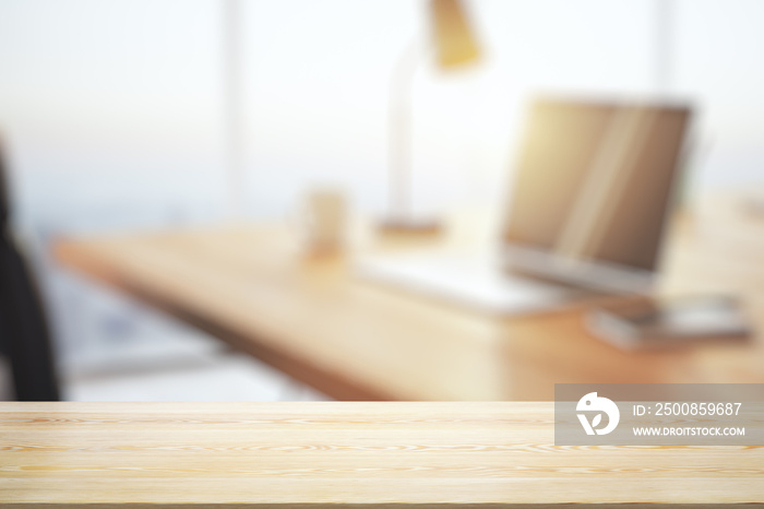 Empty office wooden table with empty space on modern workplace with computer background, close up, mockup