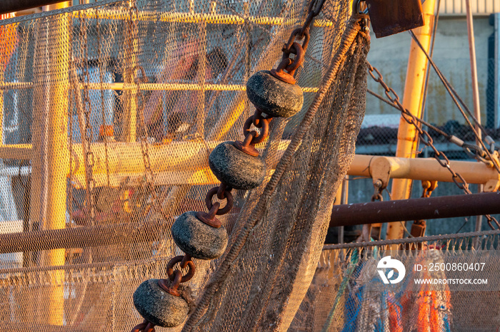 Commercial fishing nets hanging from fishing boat