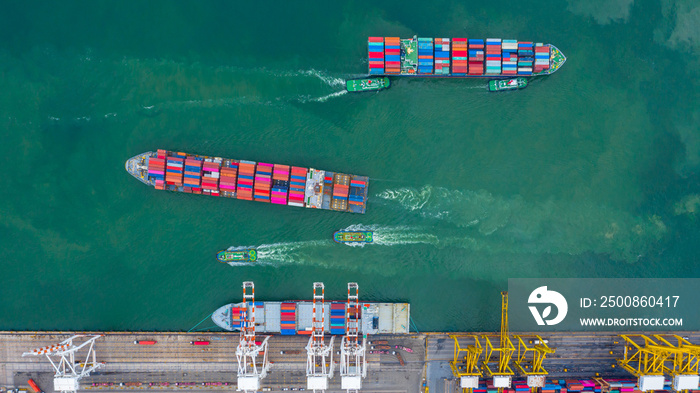 Aerial view cargo ship terminal, Unloading crane of cargo ship terminal, Aerial view industrial port with containers and container ship.