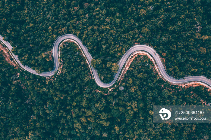 Drone view of curvng road .