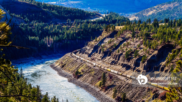 Long Freight Trains following the Thompson and Fraser Rivers along steep Cliffs and through Tunnels in the Thompson and Fraser River Canyon