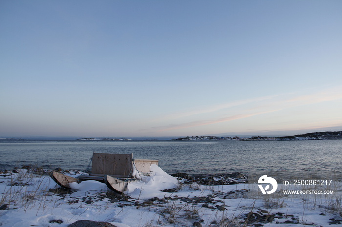 Traditional Inuit cargo sled or Komatik with a box on top and covered in snow, in the Kivalliq style, from Rankin Inlet, Nunavut, Canada