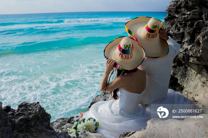 Wedding couple are modeling some mexican charro hat