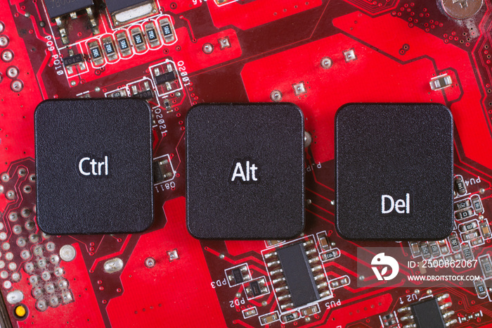 Keyboard keys form the word CTRL ALT CANC on red electric circuit in the background.