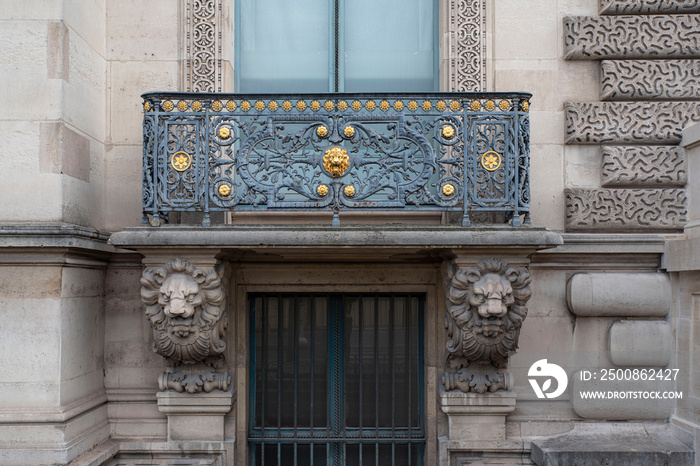 Close-up of a balcony with its sculptures and decorations at the Louvre in Paris, France