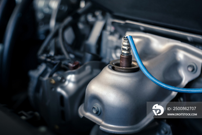 details of modern car engine, O2 oxygen sensor upstream - downstream, shallow depth of field, close up of engine compartment