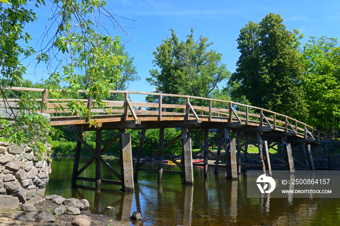 Old North Bridge and Memorial obelisk in Minute Man National Historical Park, Concord, Massachusetts MA, USA.