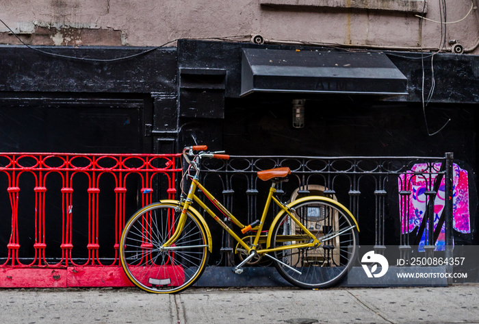 Vintage Yellow Bike in an Old Neighborhood in Soho, Manhattan, NYC. Street Photography in New York City.