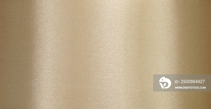 close up macro antique golden silk fabric ribbon texture abstract background with copy space.idea for luxury wallpaper,elegance fashion backdrop design.