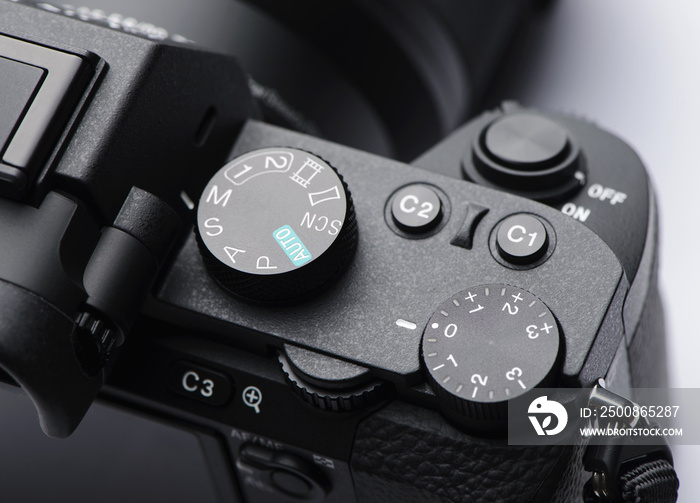 Mode dial, exposure control dial and shutter button on mirrorless camera