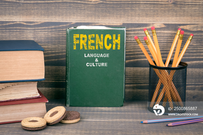 French language and culture concept. Book on a wooden background