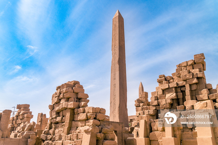 LUXOR, EGYPT: Ancient ruins of Karnak temple in Egypt at noon. The complex is a vast open-air museum, and the second largest ancient religious site in the world