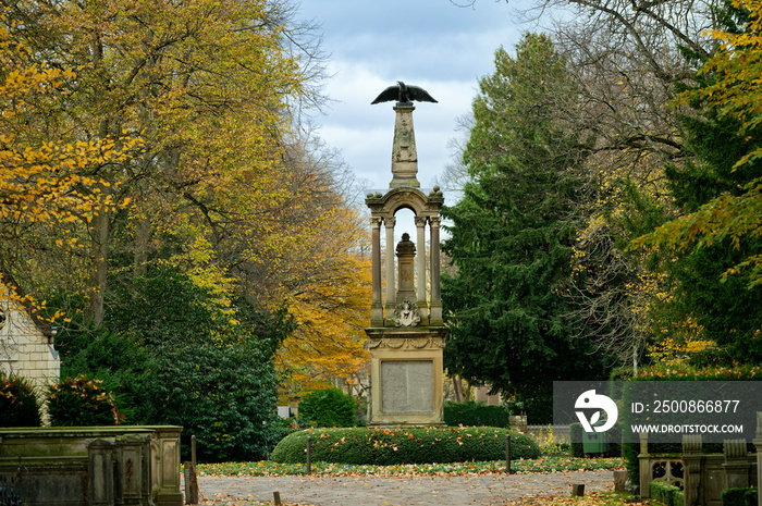 the eagle pillar on the million path of the historic cologne cemetery melaten in autumn