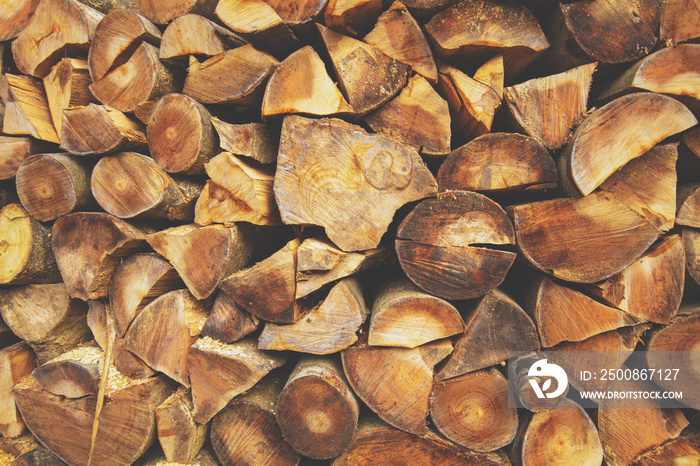 Preparing firewood for winter. Pile of cutting pine wood