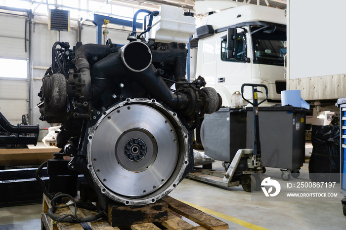 Disassembled engine at a truck repair service