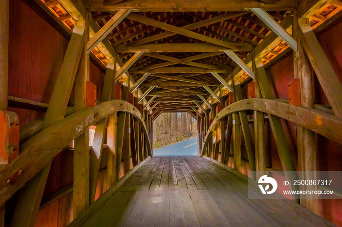 Indoor view of details of red covered bridge inside of the forest in Lancaster