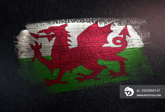 Wales Flag Made of Metallic Brush Paint on Grunge Dark Wall