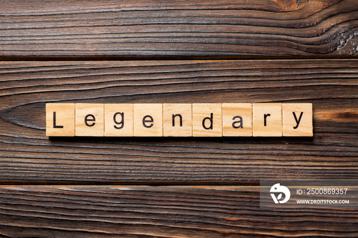 Legendary word written on wood block. Legendary text on wooden table for your desing, Top view concept