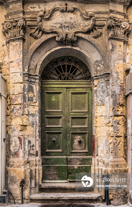 Ancient wooden doors with the bullet holes from second world war