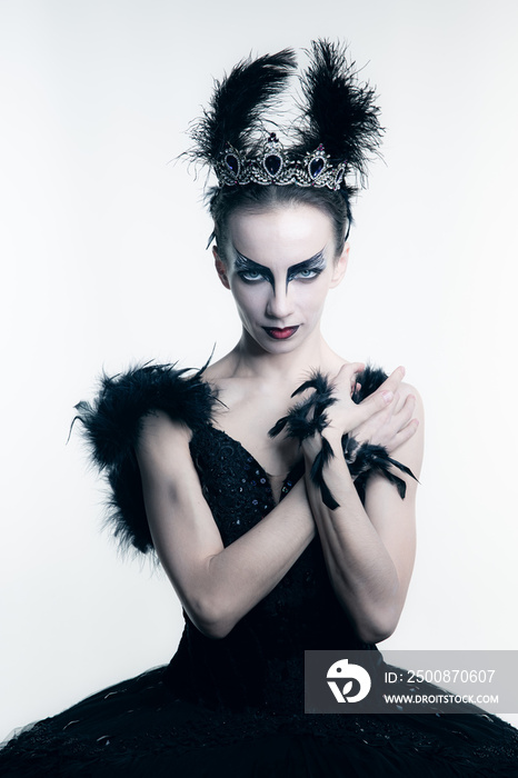 Close-up amazing woman, ballerina with stage make-up looking at camera isolated on white studio backgorund