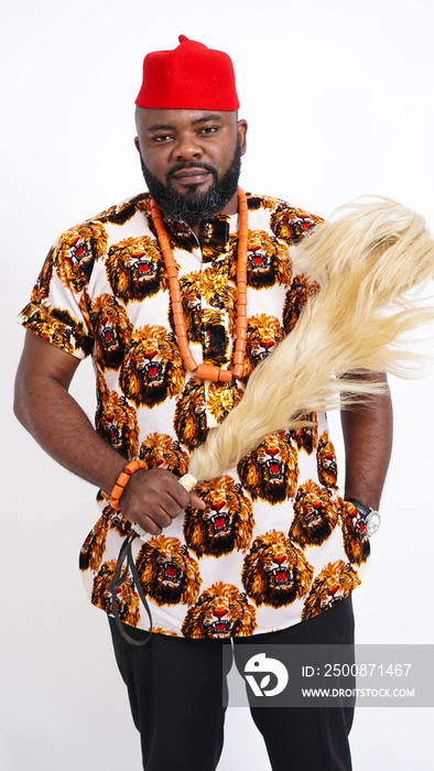 Portrait of Nigerian Igbo man dressed in traditional attire