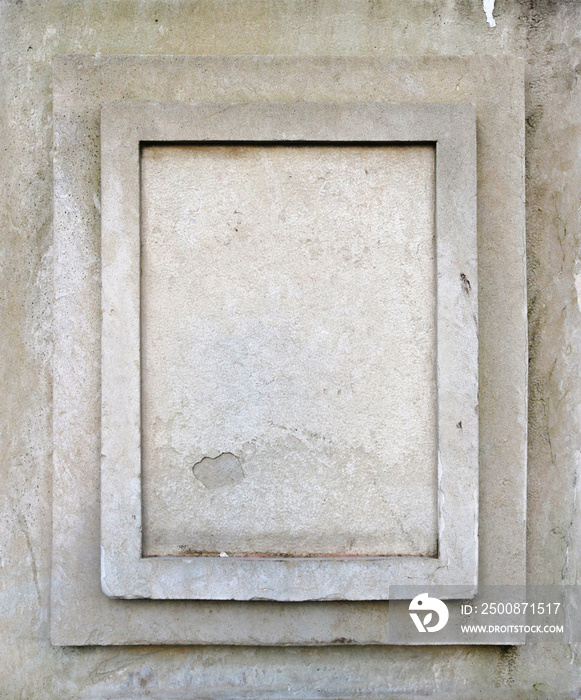 Blank vertical memorial plaque of a white weathered stone- flat rectangle surface background with several frames