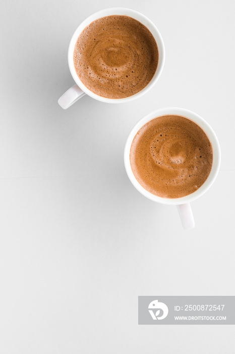 Cup of hot french coffee as breakfast drink, flatlay cups on white background