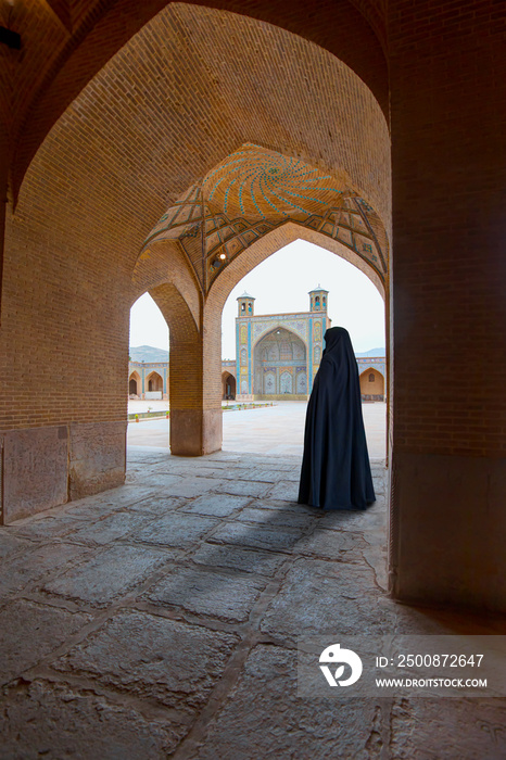 Woman in traditional abaya standing in the Vakil Mosque southern Iran. This mosque was built 1751 - Shiraz,  Iran