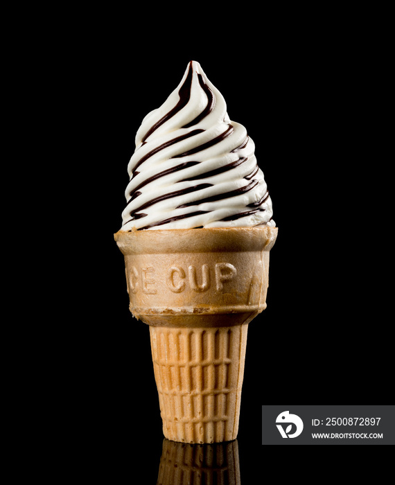 ice cream cone starts melting on a black background