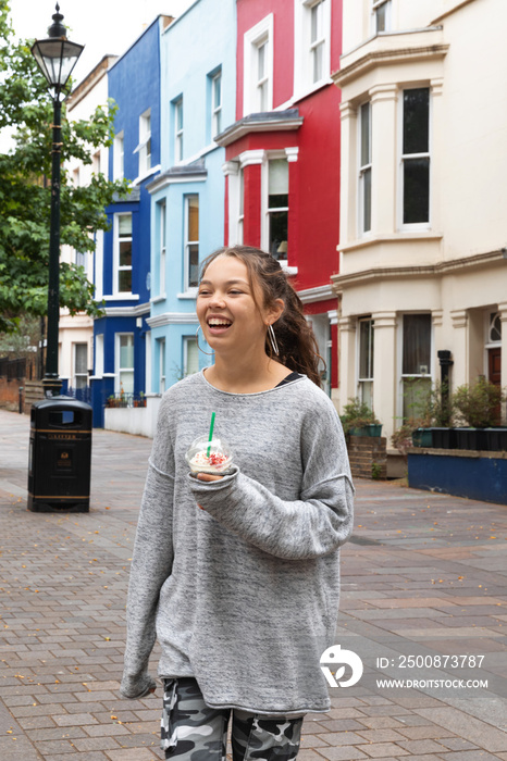 Portrait young smiling girl with a smoothie