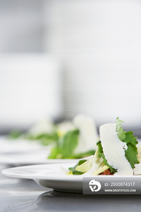 Salad With Grated Cheese On Plates