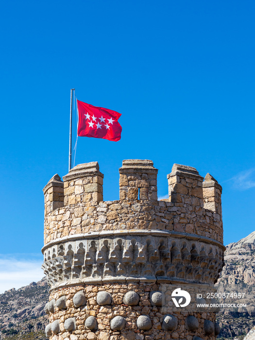 Community of Madrid Flag in a tower of the Castle Manzanares el Real in Madrid,Spain