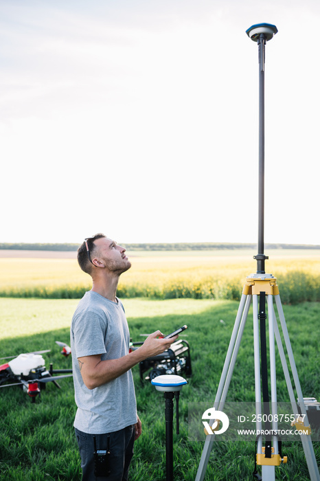 Farmer enters the GPS coordinates for the agricultural drone