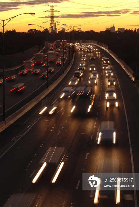 Blurred lights of traffic leaving Melbourne at Sunset on the freeway to the east.