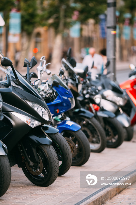 Motorbike, Motorcycle Scooters Parked In Row In City Street.